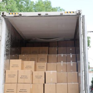 Open container filled with brown cartons of wholesale canvas tote bags ready for export shipping