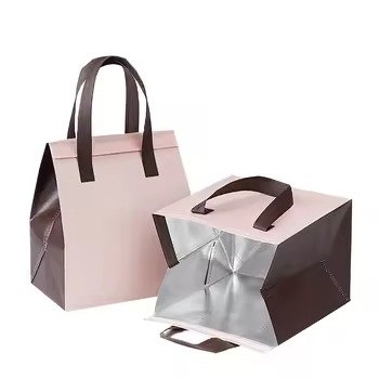 Set of two pink and brown reusable insulated tote bags with silver thermal lining and handles, ideal for food delivery, takeaway packaging, and thermal preservation.