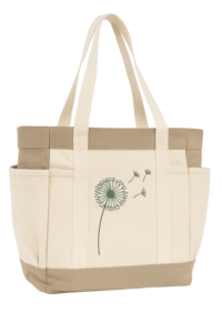 Durable beige canvas tote bag featuring a green dandelion print, reinforced handles, and side pockets for daily shopping or events.