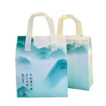 Set of two reusable insulated tote bags with Chinese-style mountain print design and white handles, ideal for food packaging, gift bags, and takeaway use.