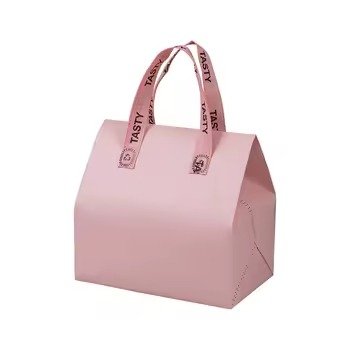 Plain pink reusable insulated tote bag with printed ribbon handles, ideal for bakery packaging, food delivery, and customizable gift use.