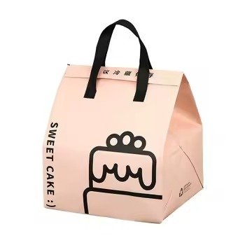 Pink reusable insulated tote bag with black handles and cake print design, ideal for bakery packaging, food takeaway, and dessert gift use.