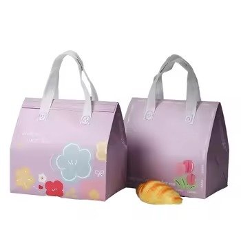 Set of two purple reusable insulated tote bags with floral print and white handles, ideal for bakery packaging, food takeaway, and gift use.