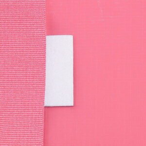 Close-up of strong velcro strap on durable pink storage moving bag, ideal for secure packing and easy access
