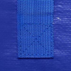 Reinforced handle stitched on blue moving bag for secure lifting