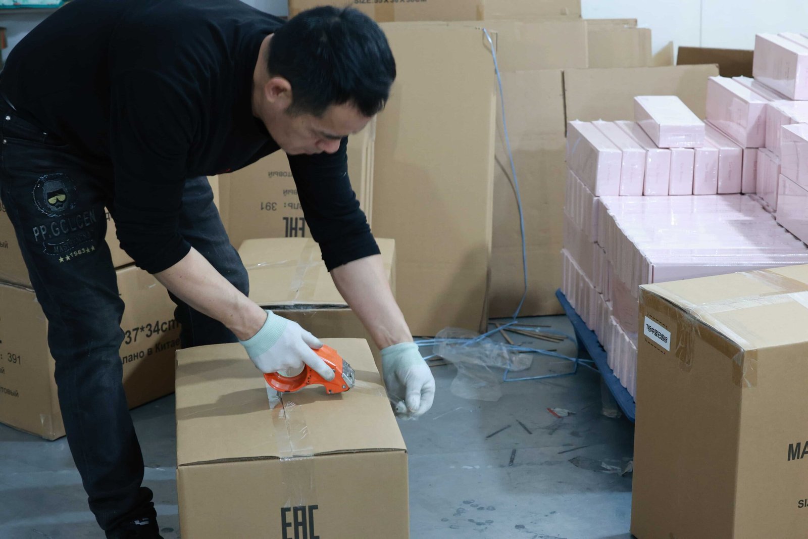 Packaging operation sealing finished reusable garment bags for shipment