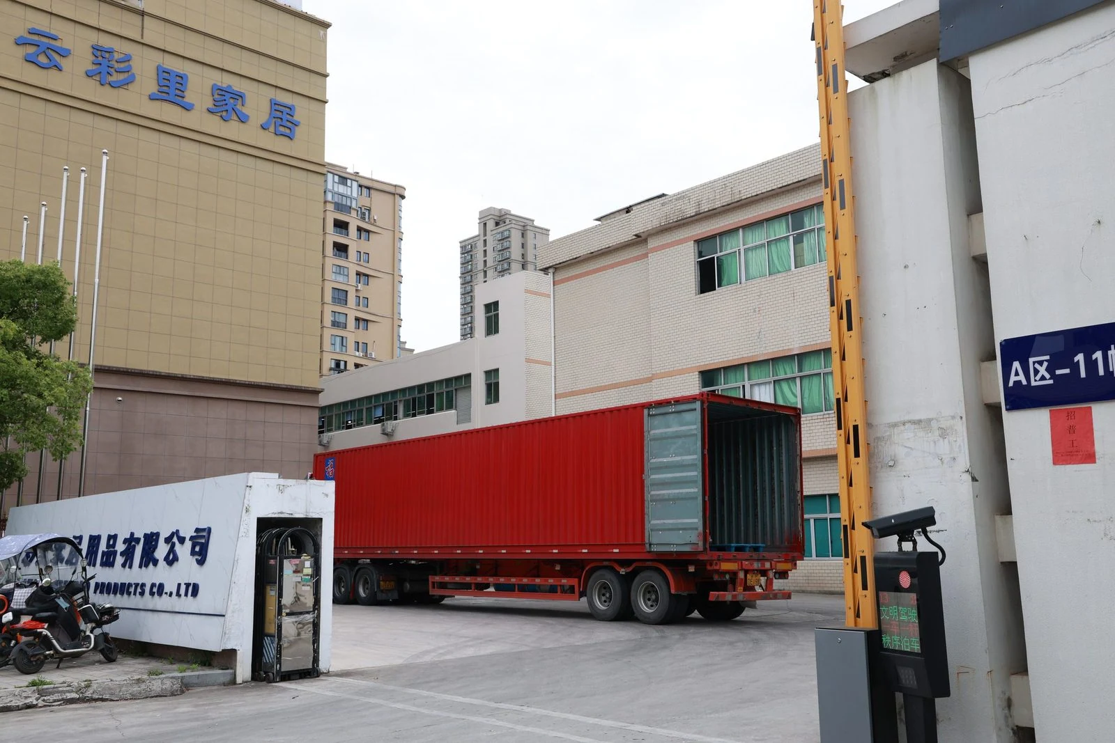 Moving Bags Manufacturing Tiiocti Red Container Truck With Open Rear Doors Parked In The Factory Yard Beside The Entrance
