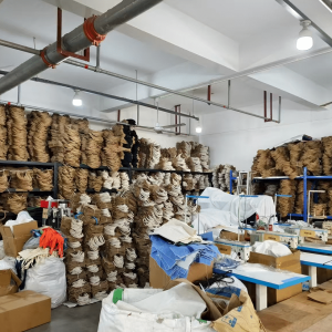 Bulk storage of jute drawstring bags in a factory warehouse, wholesale packaging production