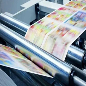 Offset printing machine in action, printing colorful sheets rapidly High-speed printing machine producing colorful custom patterns on fabric rolls, ideal for large-scale tote bag and textile printing