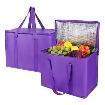 Purple reusable insulated grocery tote bags with handles, filled with fruits and vegetables, ideal for food delivery, supermarket shopping, and thermal preservation.