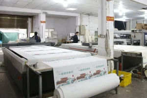 Automated printing machine processing fabric rolls for custom logo tote bags