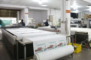 Automated printing machine processing fabric rolls for custom logo tote bags