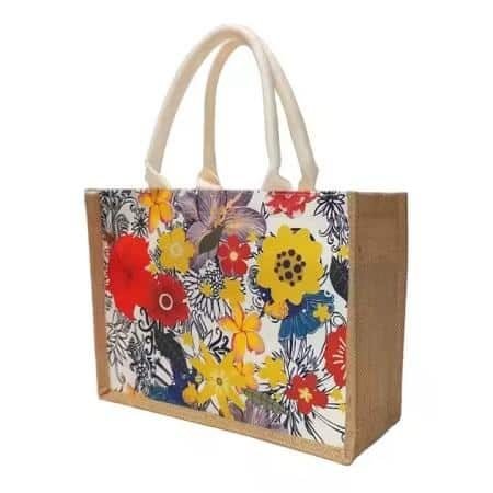 Handmade jute tote bag with bohemian pattern and black handle