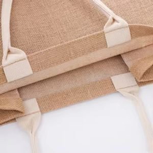Stack of natural jute tote bags with reinforced handles, bulk packaging view