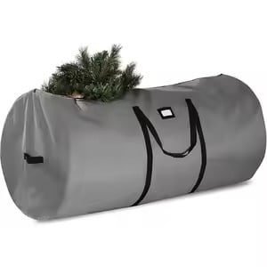 Large gray cylindrical storage bag with black handles, partially filled with artificial Christmas tree branches, ideal for holiday decoration storage and transport
