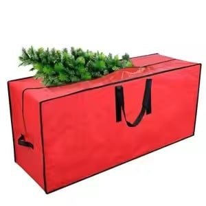 Large red rectangular storage bag with black handles, filled with artificial Christmas tree branches, ideal for holiday decoration storage and transportation