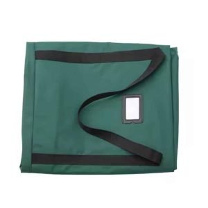 Folded green Christmas tree storage bag with black handles and label slot