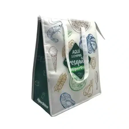 Reusable insulated shopping bag with food-themed prints, sturdy white handles, eco-friendly design for grocery and frozen items.