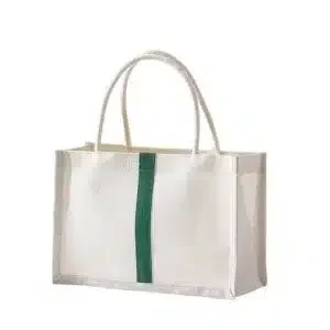 Eco-friendly jute shopping bag with green vertical stripe and white handles, reusable and biodegradable.